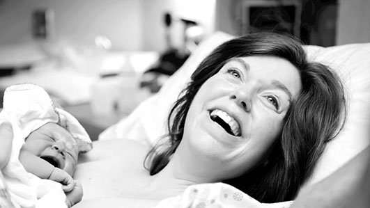 Mother with newborn baby - just born.