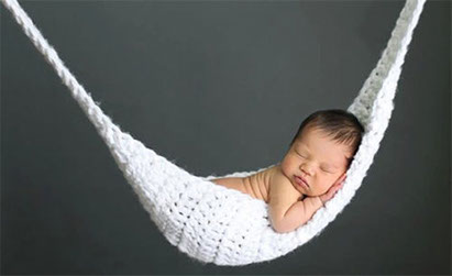 newborn baby in hammock